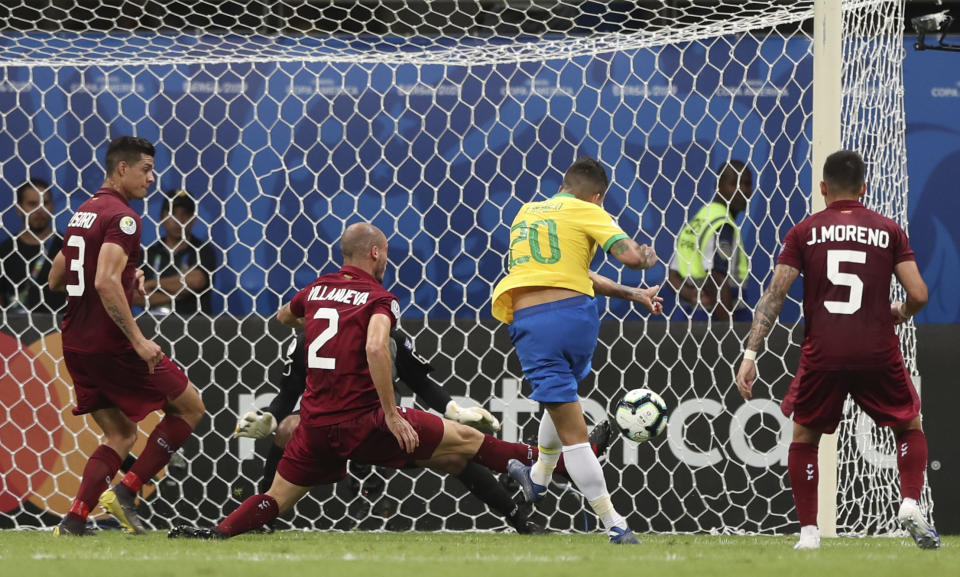 Brazil's Roberto Firmino shoots to score a goal that was disallowed by the referee during a Copa America Group A soccer match against Venezuela at the Arena Fonte Nova in Salvador, Brazil, Tuesday, June 18, 2019. (AP Photo/Ricardo Mazalan)