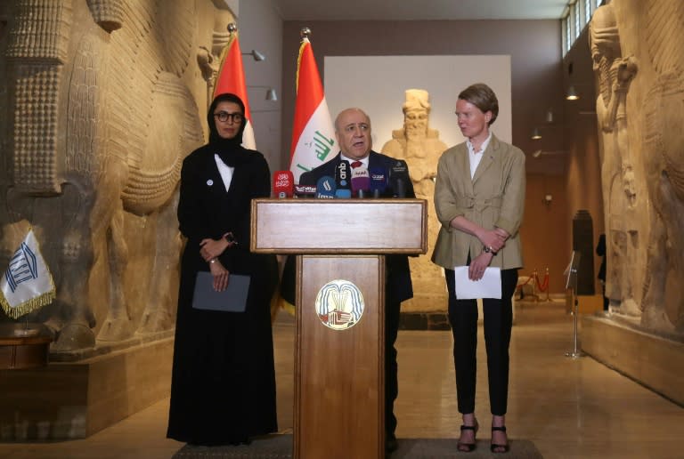 UNESCO's Louise Haxthausen (R), UAE Culture Minister Noura al-Kaabi (L) and her Iraqi counterpart Faryad Rawanduzi (C) give a joint news conference after the signing of an agreement on the reconstruction of Mosul's Al-Nuri mosque