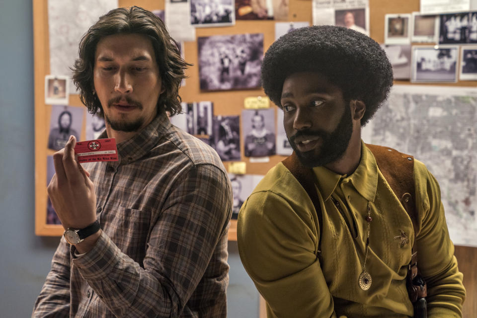 This image released by Focus Features shows Adam Driver, left, and John David Washington in a scene from "BlacKkKlansman." The cast was nominated for a SAG Award for best ensemble. The SAG Awards will be held Jan. 27 and broadcast live by TNT and TBS. This year's show will honor Alan Alda with the Screen Actors Guild Life Achievement Award. (David Lee/Focus Features via AP)