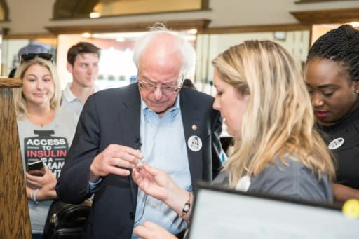 Democratic presidential candidate Bernie Sanders joins a diabetes patient at a pharmacy on a trip to Canada for affordable insulin on July 28, 2019 in Windsor, Canada