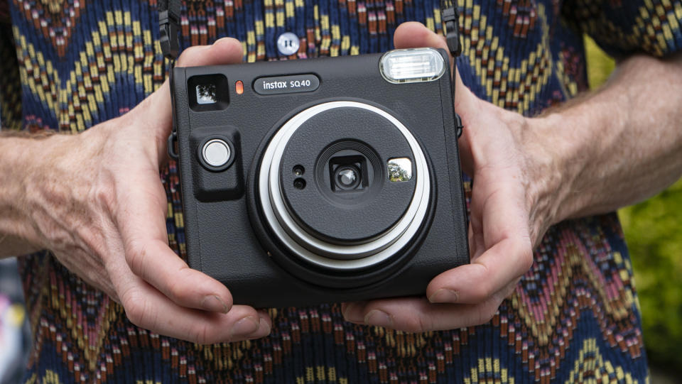 Fujifilm Instax SQ40 camera in reviewer's hands