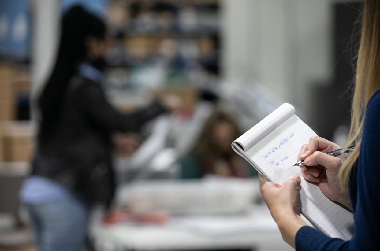 <span class="caption">Not in Russia: An election observer takes notes as Gwinnett County workers process ballots in Lawrenceville, Georgia, Nov. 6.</span> <span class="attribution"><a class="link " href="https://www.gettyimages.com/detail/news-photo/an-observer-takes-notes-as-they-watch-gwinnett-county-news-photo/1229497470?adppopup=true" rel="nofollow noopener" target="_blank" data-ylk="slk:Jessica McGowan/Getty Images;elm:context_link;itc:0;sec:content-canvas">Jessica McGowan/Getty Images</a></span>