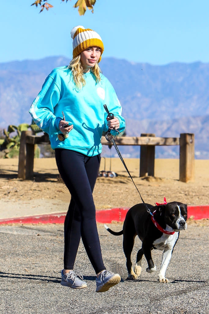 <p>The<em> Voice</em> coach sported a cute knit cap with a pompom as she went for a hike with her beloved companion. No, it wasn’t Liam this time — it was her pit bull, Mary Jane. Earlier this month, Miley <a rel="nofollow noopener" href="https://www.instagram.com/p/BcOz6pGBmZ6/" target="_blank" data-ylk="slk:got a new tattoo;elm:context_link;itc:0;sec:content-canvas" class="link ">got a new tattoo</a> on her right elbow honoring the pup. (Photo: LESE/BackGrid)<br><br></p>