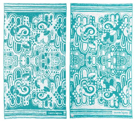 This product image released by One Kings Lane shows a Nanette Lepore reversible beach blanket in a Gustav Klimt-inspired motif in turquoise and white. Online retailer One King’s Lane has partnered with a number of well-known designers on a beach towel collection that rolls out through the summer. Proceeds support the designers’ preferred charities, including Alpha Workshops, which helps HIV-AIDS victims, and Baby2Baby, which assists Los Angeles families in need. (AP Photo/One Kings Lane)