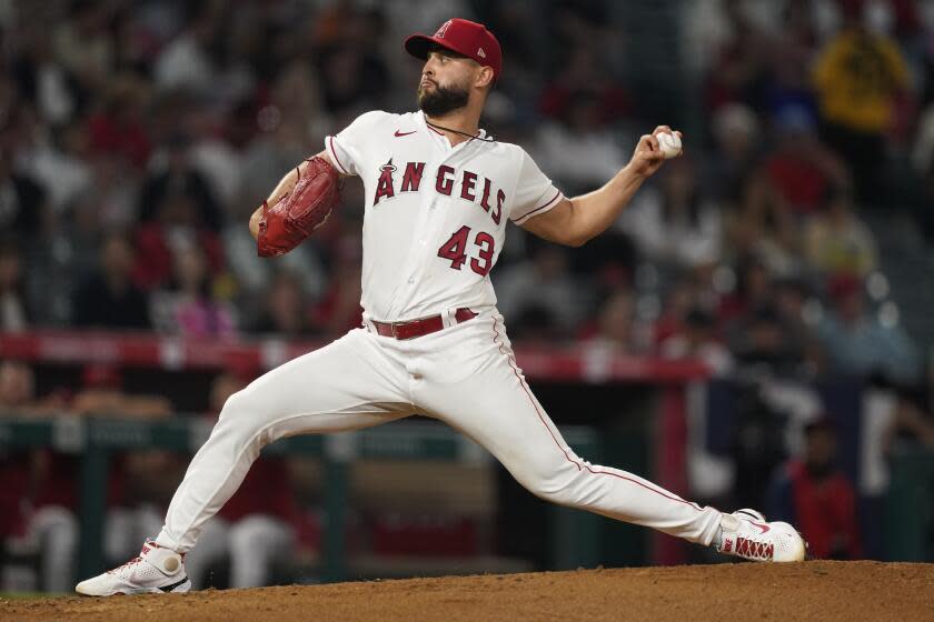 Angels starting pitcher Patrick Sandoval throws against the Rangers on Monday.