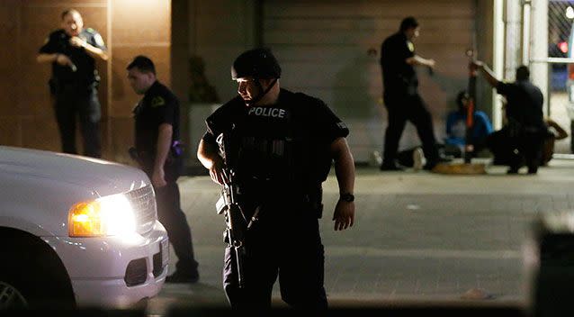 Dallas police had two in custody after officers were shot in downtown Dallas. Source: AP Photo/LM Otero