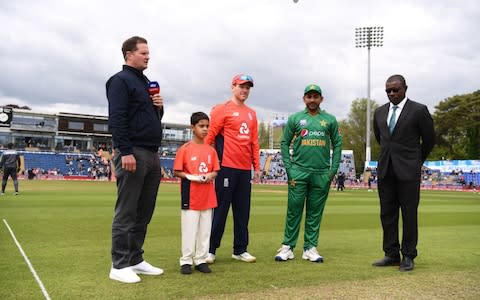 England captain Eoin Morgan tosses the coin before the Twenty20 International match between England and Pakistan at Sophia Gardens - Credit: Getty