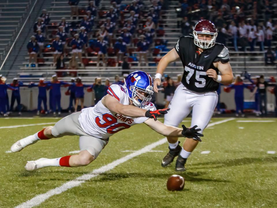 Austin, TX: Westlake Chaparrals defensive lineman Ethan Burke (90) dives to recover a loose ball against the Austin Maroons but called dead during the first quarter at the District 26-6A football game on Friday, Oct. 29, 2021, at Toney Burger Stadium.
