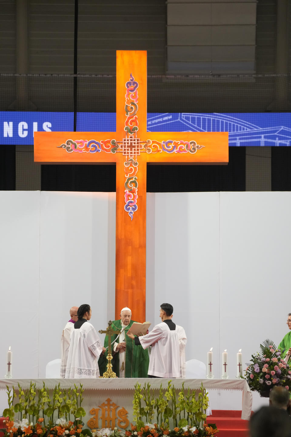 Pope Francis presides over a mass at the Steppe Arena in the Mongolian capital Ulaanbaatar, Sunday, Sept. 3, 2023. Francis is in Mongolia to minister to one of the world's smallest and newest Catholic communities. Neighboring China's crackdown on religious minorities has been a constant backdrop to the trip, even as the Vatican hopes to focus attention instead on Mongolia and its 1,450 Catholics. (AP Photo/Andrew Medichini)