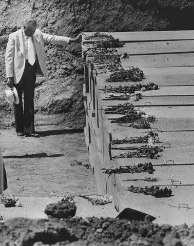 <p>Roy H. Williams/MediaNews Group/Oakland Tribune/Getty</p> A mourner reflects in a moment of prayer before the burial of Jonestown victims at Evergreen Cemetery in Oakland, California on May 24, 1979.