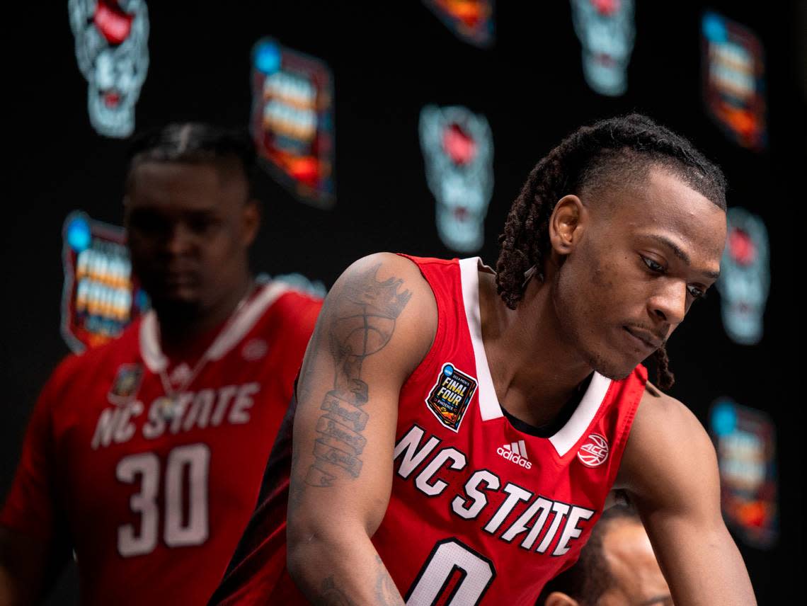 N.C. State’s D.J. Horne (0) and D.J. Burns Jr. (30) take their seats on the dais to meet with the media following the Wolfpack’s loss to Purdue in the NCAA Final Four National Semifinal game on Saturday, April 6, 2024 at State Farm Stadium in Glendale, AZ. Robert Willett/rwillett@newsobserver.com