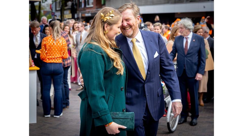 King Willem-Alexander with his arm around Crown Princess Catharina-Amalia