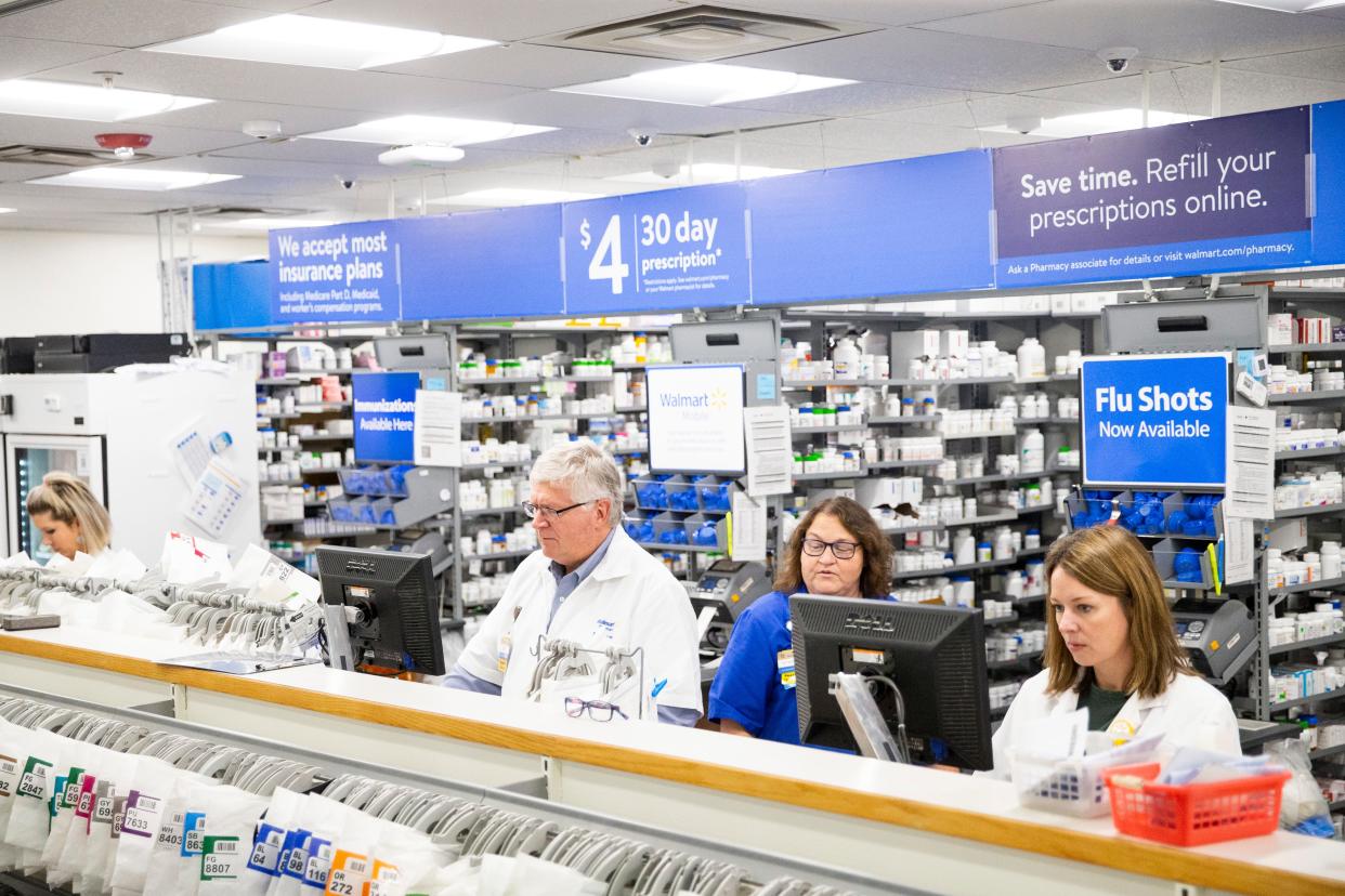 Pharmacists work at the Walmart Pharmacy in Collierville, Tenn., on Wednesday, January 24, 2024. The pharmacists at the Collierville pharmacy have almost 166 years of combined experience at Walmart.