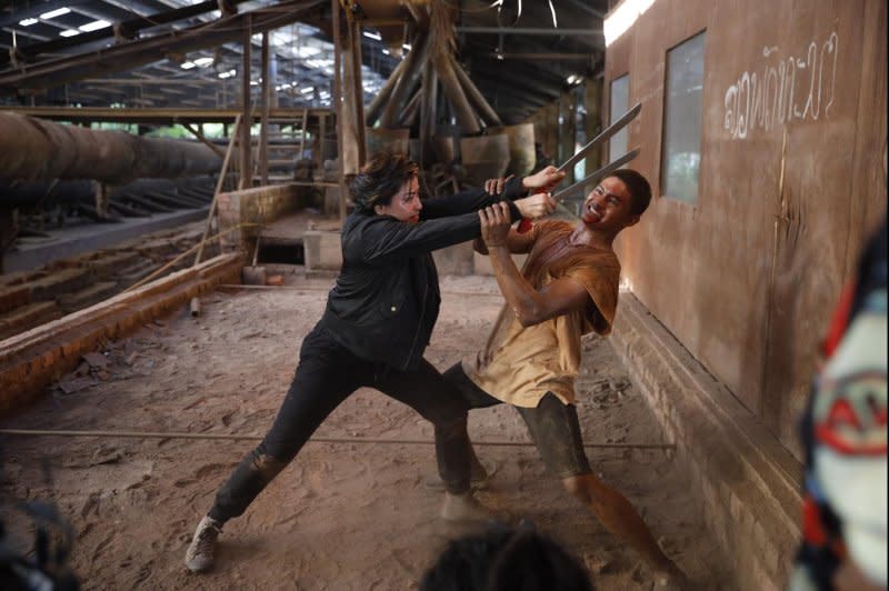 Marina (L) fights Jebat Zulfar in "Walid." Photo courtesy of Outsider Pictures