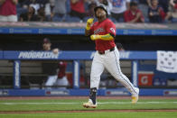 Cleveland Guardians' José Ramírez gestures as he runs to home plate on a home run against the New York Mets during the fifth inning of a baseball game Tuesday, May 21, 2024, in Cleveland. (AP Photo/Sue Ogrocki)