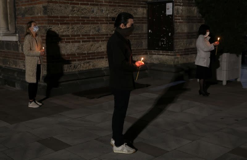 People attend Orthodox Easter service outside Sveti Sedmochislenitsi church in Sofia