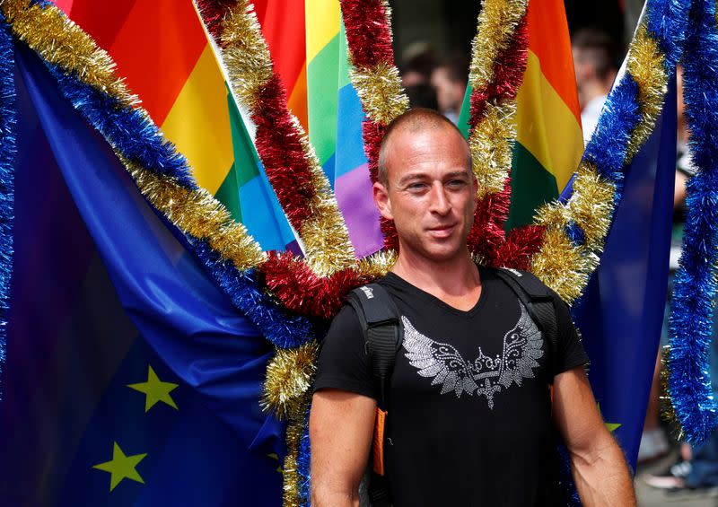 FILE PHOTO: A reveller takes part in the annual Gay Pride parade, also called Christopher Street Day parade (CSD), in Berlin