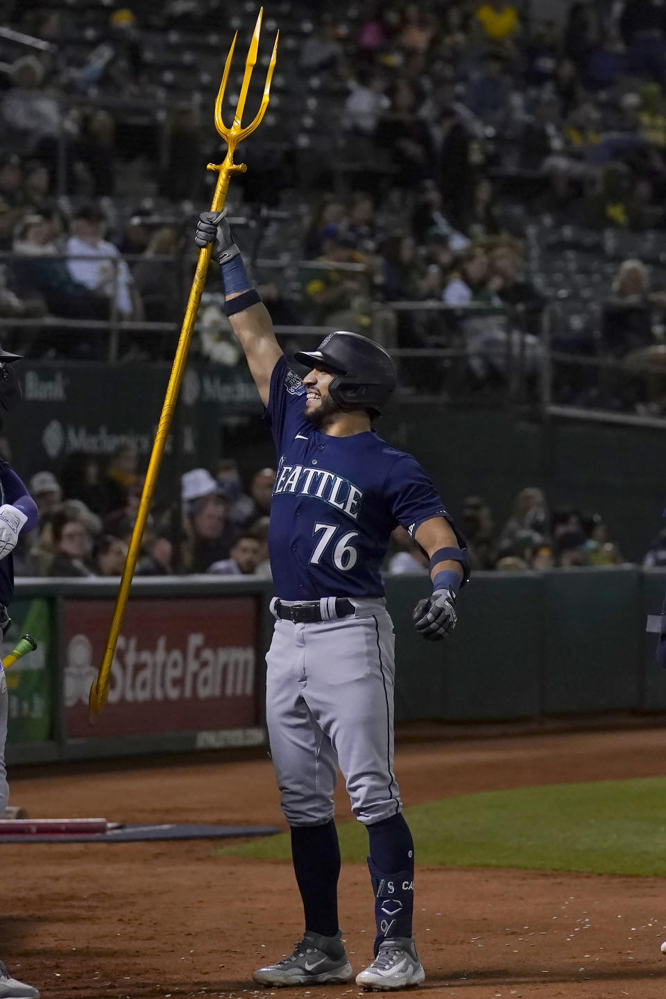 Seattle Mariners' Jose Caballero (76) celebrates after hitting a two-run home run against the Oakland Athletics during the fourth inning of a baseball game in Oakland, Calif., Monday, Sept. 18, 2023. (AP Photo/Jeff Chiu)