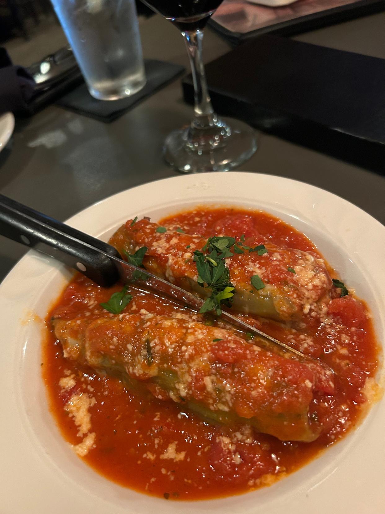 Banana peppers stuffed with Italian sausage and topped with marinara sauce and melted provolone are among eight appetizer choices at the Italian Santosuosso's restaurant in Medina Township.