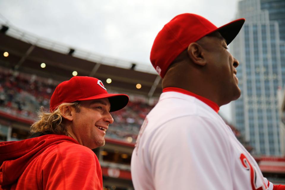 Bronson Arroyo, left, shares a laugh with former Reds third-base coach Billy Hatcher.