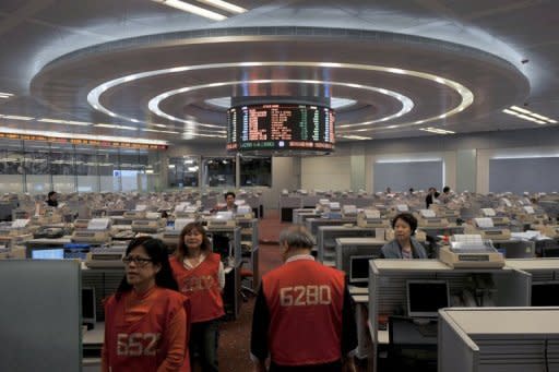 Traders walk the floor of the Hong Kong Stock Exchange on March 7. Hong Kong's new stock exchange chief vowed Tuesday to provide an "orderly and fair" trading platform, amid concern about low quality listings in the world's biggest IPO market