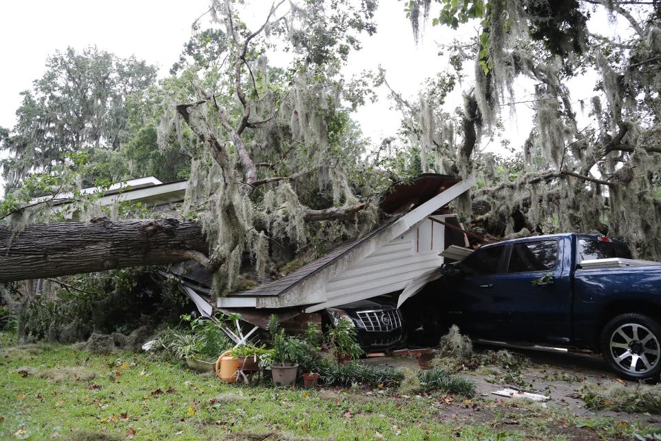 A large Oak tree fell on the carport at a Windsor Forest home as Hurricane Idalia moved through Georgia on Wednesday, August 30, 2023.