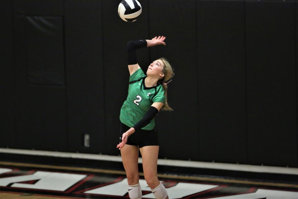 Yorktown's Addi Applegate serves in the Delaware County volleyball tournament championship at Wapahani High School on Saturday, Oct. 1, 2022.