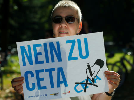 A demonstrator prostests against the Comprehensive Economic and Trade Agreement (CETA) at the Constitutional Court in Karlsruhe, Germany August 31, 2016. REUTERS/Ralph Orlowski