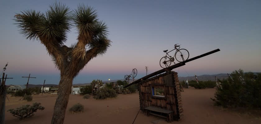 A bicycle appears ready to ride into the sunset at the Noah Purifoy Outdoor Desert Museum in Joshua Tree, a 10-acre installation created by the late L.A. artist.