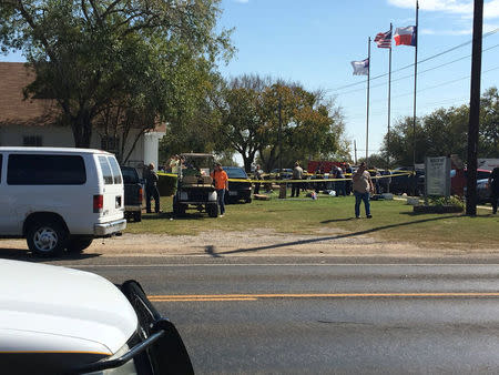 NO ARCHIVES REFILE - ADDING DISCLAIMER The area around a site of a mass shooting is taped off in Sutherland Springs, Texas, U.S., November 5, 2017, in this picture obtained via social media. MAX MASSEY/ KSAT 12/via REUTERS