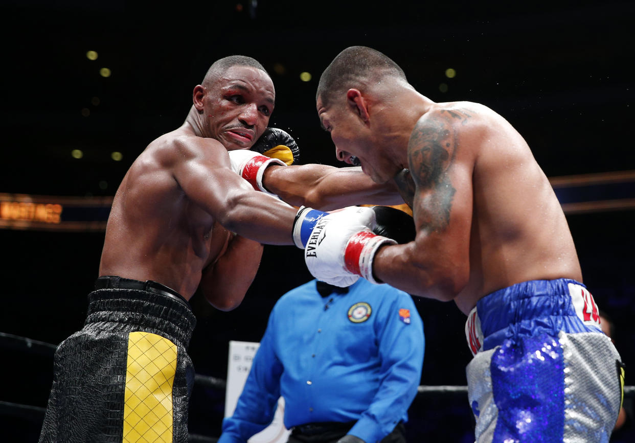 Devon Alexander (left) exchanges punches with Aaron Martinez during their 2015 bout. (Reuters)