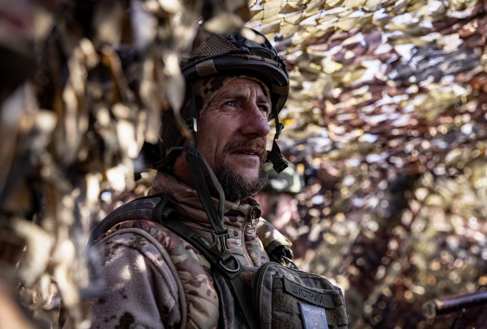 A Ukrainian serviceman looks on at a position near a frontline in Donetsk region (REUTERS)