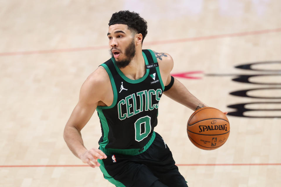 Jayson Tatum #0 of the Boston Celtics handles the ball in the first quarter against the Portland Trail Blazers at Moda Center on April 13, 2021 in Portland, Oregon. NOTE TO USER: User expressly acknowledges and agrees that, by downloading and or using this photograph, User is consenting to the terms and conditions of the Getty Images License Agreement. (Photo by Abbie Parr/Getty Images)