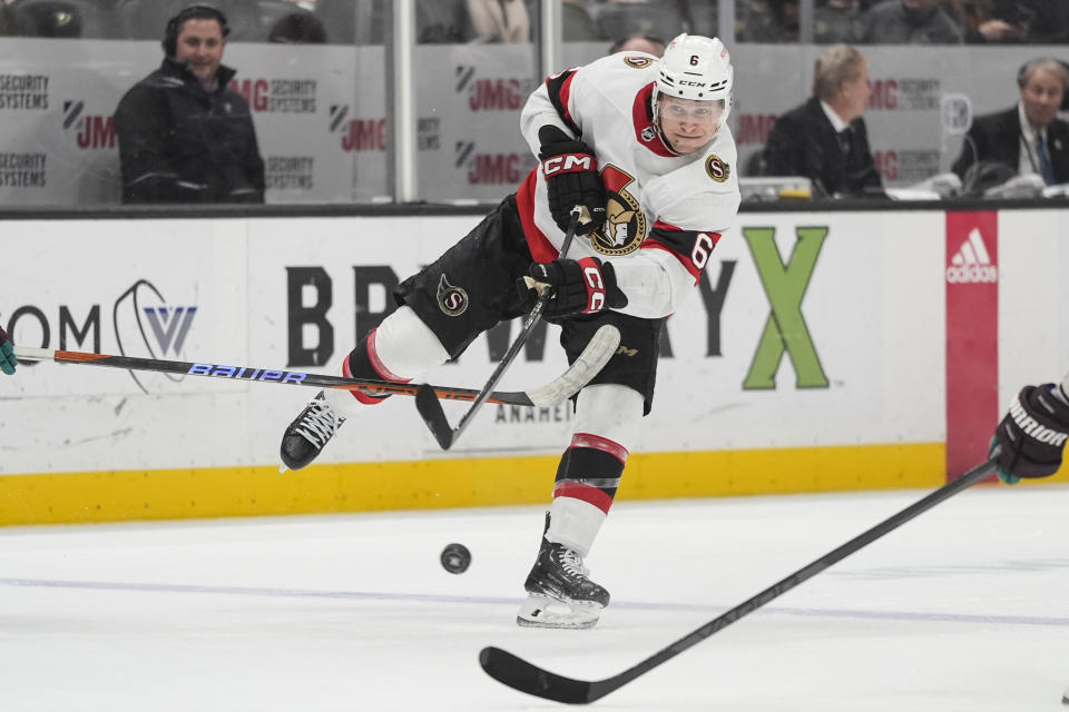 Ottawa Senators' Jakob Chychrun (6) hits the puck during the second period of an NHL hockey game against the Anaheim Ducks Wednesday, March 6, 2024, in Anaheim, Calif. (AP Photo/Jae C. Hong)