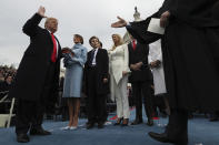 <p>President Donald Trump takes the oath of office from Chief Justice John Roberts, as his wife Melania holds the bible, and with his children Barron, Ivanka, Eric and Tiffany, Friday, Jan. 27, 2017 on Capitol Hill in Washington. (Photo: Jim Bourg/Pool Photo via AP) </p>