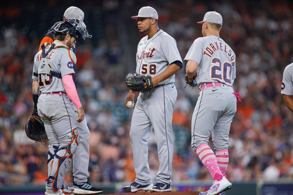Detroit Tigers starting pitcher Wily Peralta (58) gets a mound visit during the first inning against the Houston Astros at Minute Maid Park.