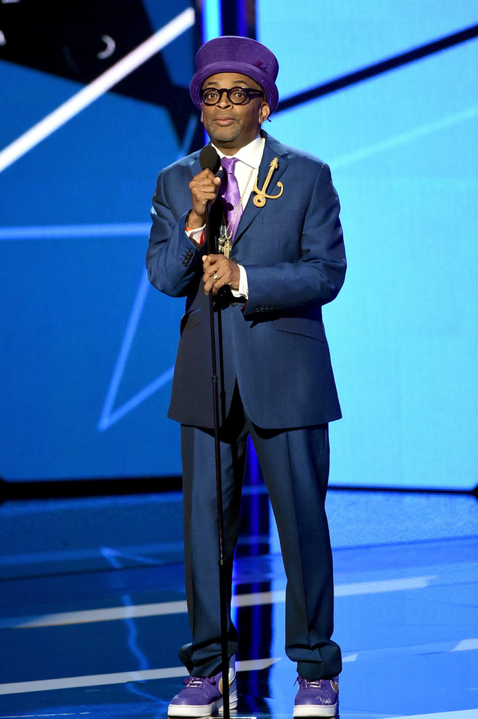 <p>Spike Lee, who gave Samuel L. Jackson his Lifetime Achievement Award, dressed to honor Prince in purple and yellow sneakers, purple tie, Prince symbol pin, and a top hat. Many compared the director’s honorific look to Willy Wonka. <i>(Photo: Getty Images)</i></p>