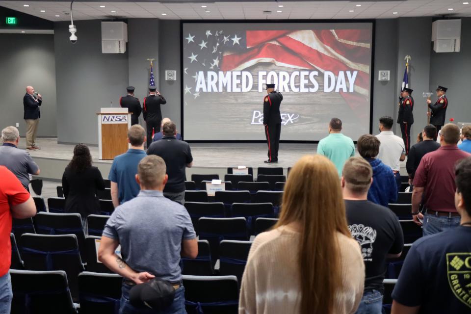 The Pantex Fire Department Honor Guard place the flags for the annual Pantex Armed Forces Day ceremony Tuesday morning.