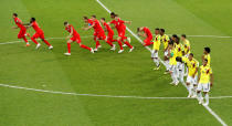 <p>England players celebrate while Colombia react after the penalty shootout. REUTERS/Christian Hartmann </p>