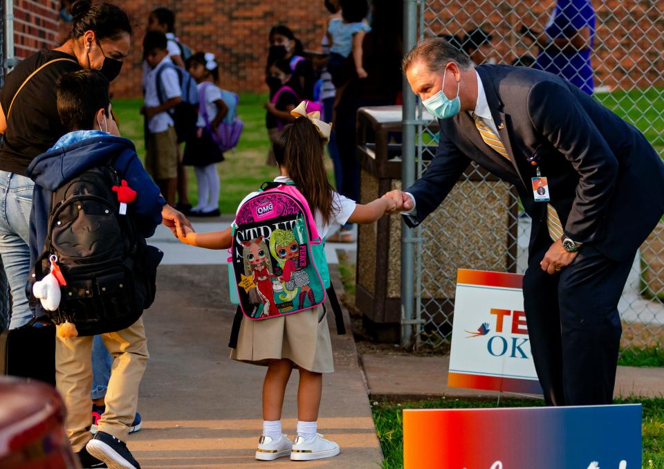 Oklahoma City Public School superintendent Dr. Sean McDaniel gives fist bumps to students as they arrive at Rockwood Elementary for Oklahoma City Public SchoolÕs first day of class  on Monday, Aug. 9, 2021, in Oklahoma City, Okla. 