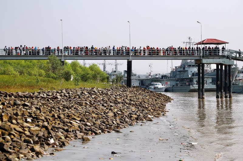 Rohingyas board a ship as they are moved to Bhasan Char island in Chattogram, Bangladesh