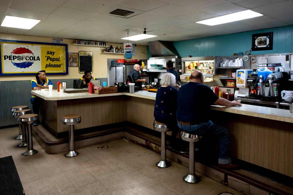 Patrons sit to eat at the Madison Diner in Madisonville on Wednesday, June 14, 2023.