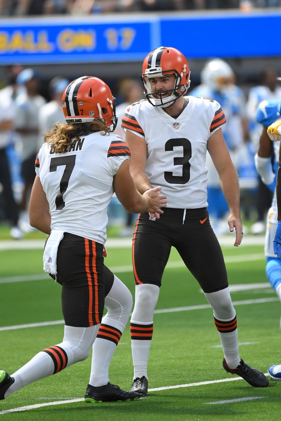 Cleveland Browns kicker Chase McLaughlin (3) shakes hands with place holder Jamie Gillan (7) after making a field goal during the first half of an NFL football game against the Los Angeles Chargers Sunday, Oct. 10, 2021, in Inglewood, Calif. (AP Photo/Kevork Djansezian)