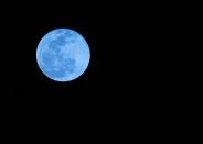 This photo of a blue moon was taken from Boca Raton, Fla., on New Year's Eve 2009. Blue moons aren't actually blue-hued, though that's not to say humans haven't seen blue and even green moons.