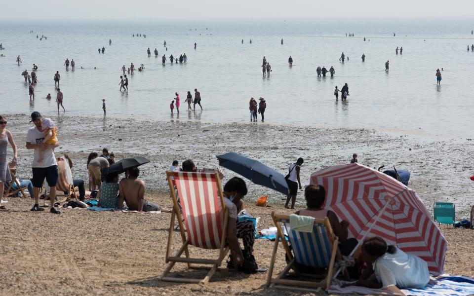 Sunbathers at Southend on Monday. Temperatures are expected to be high again on Tuesday - GETTY IMAGES