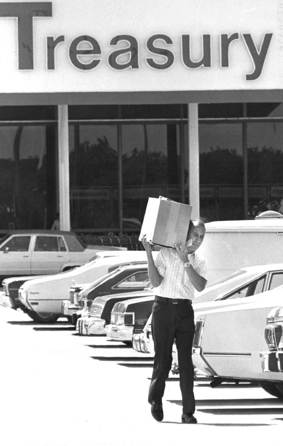 In 1981, a customer leaves a Treasury store on 49th Street in Hialeah with amplifiers for his car.
