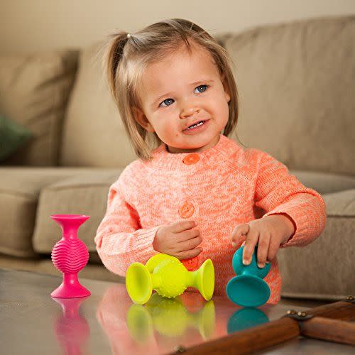 <p><strong>Fat Brain Toys</strong></p><p>amazon.com</p><p><strong>$21.95</strong></p><p><a href="https://www.amazon.com/dp/B00H4IQ3P2?tag=syn-yahoo-20&ascsubtag=%5Bartid%7C10055.g.29024275%5Bsrc%7Cyahoo-us" rel="nofollow noopener" target="_blank" data-ylk="slk:Shop Now" class="link ">Shop Now</a></p><p>Colorful with a variety of textures, these toys are safe for squeezing, teething and keeping your baby occupied.</p>