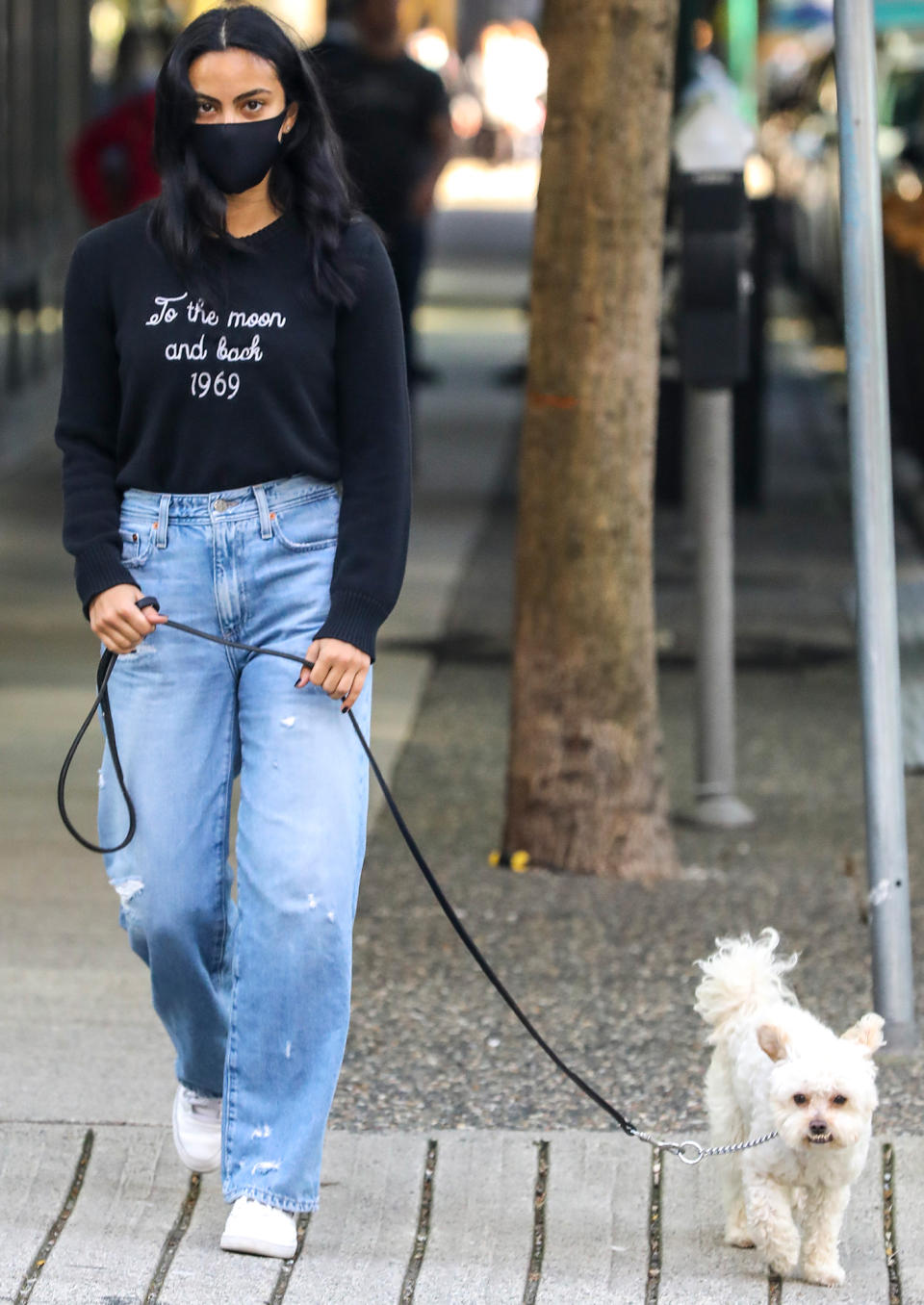 <p>Camila Mendes walks her dog while out and about in Vancouver on Thursday.</p>