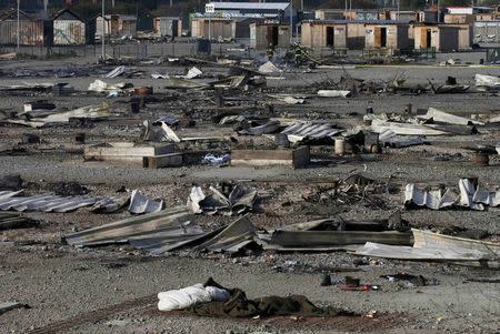 General view of shelters the day after a fire destroyed large swathes of the Grande-Synthe migrant camp near Dunkirk in northern France April 11, 2017 following skirmishes on Monday that injured several people. REUTERS/Pascal Rossignol