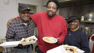 The late Marion Conner and his wife, Emma, were longtime volunteers at the Community Life Church of God food program. Marion Conner died on Jan. 12. Pictured with them is Raheen Haynes, whom Conner befriended and mentored.